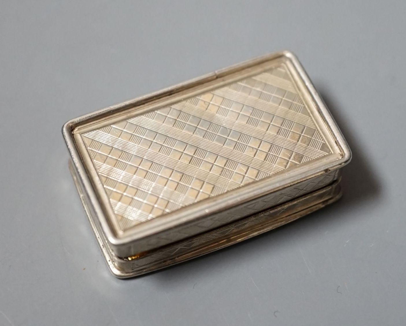 An early Victorian engraved silver rectangular vinaigrette, by Nathaniel Mills, Birmingham, 1839, 34mm.